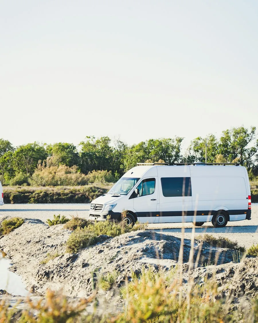 White service van parked along a rural road